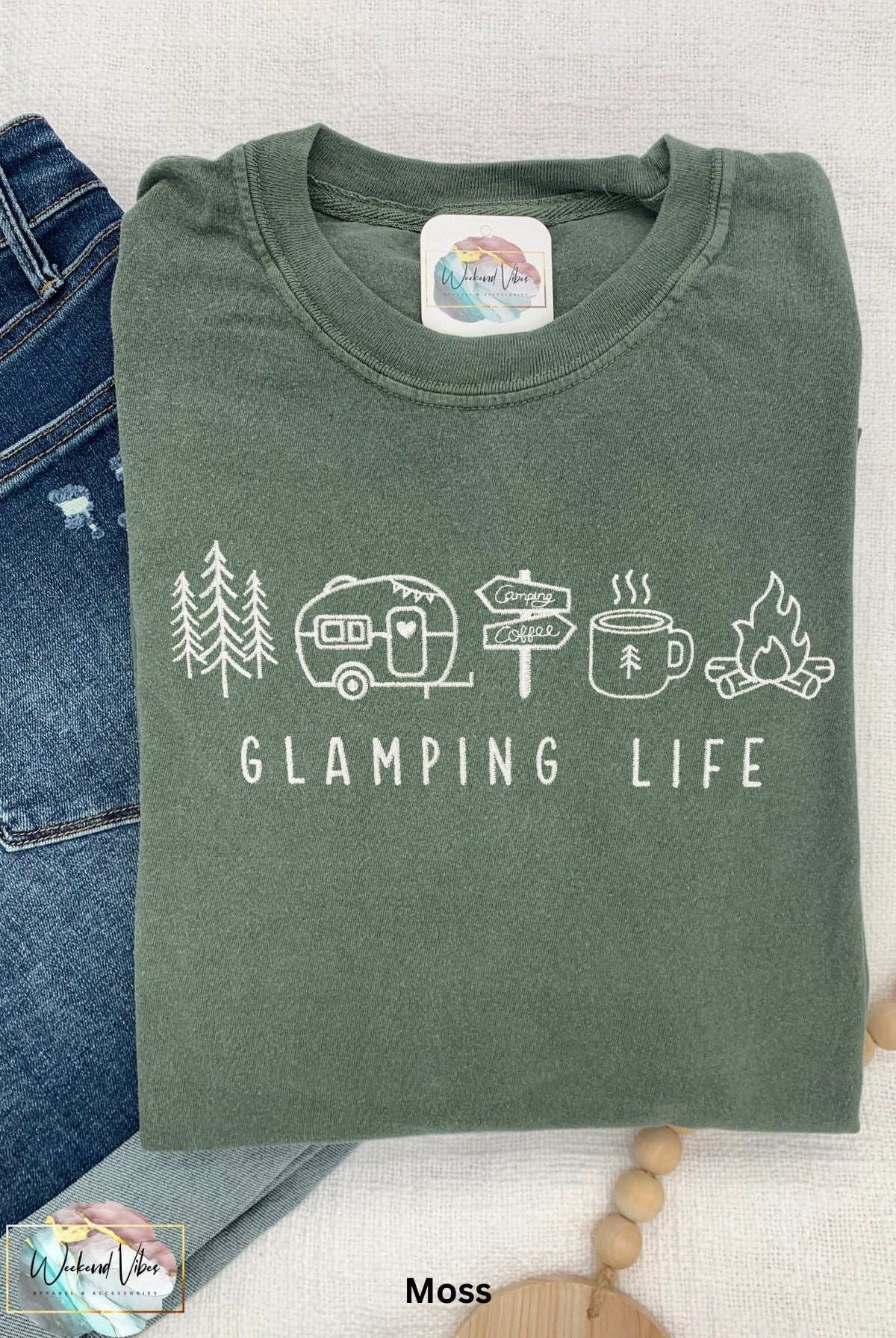 Embroidered blue spruce Comfort Colors tee with embroidered "GLAMPING LIFE" and camping icons. Icons include: A tree, travel trailer, camping signs, coffee cup, and campfire.