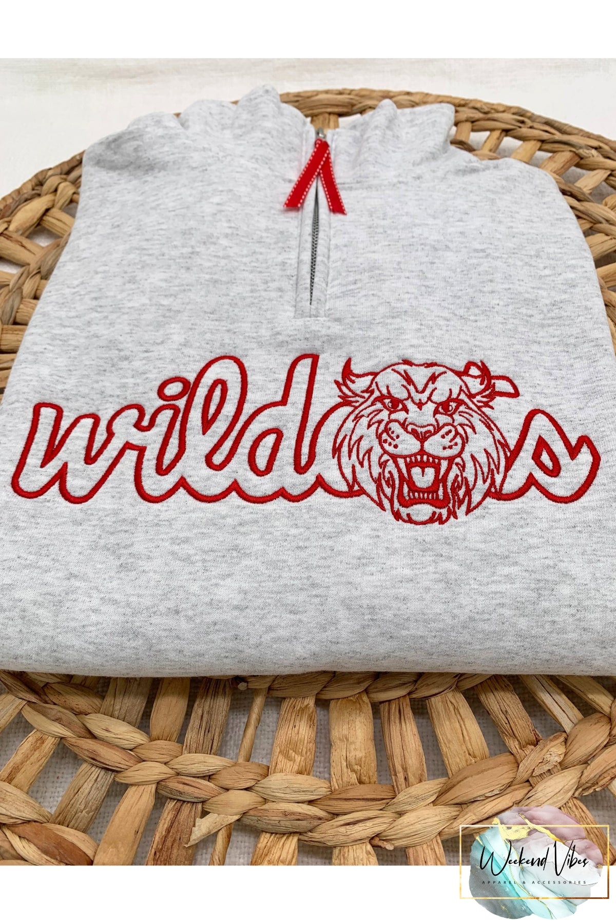Wildcats sports team mascot embroidered on an ash gray sweatshirt. Thread color is red.