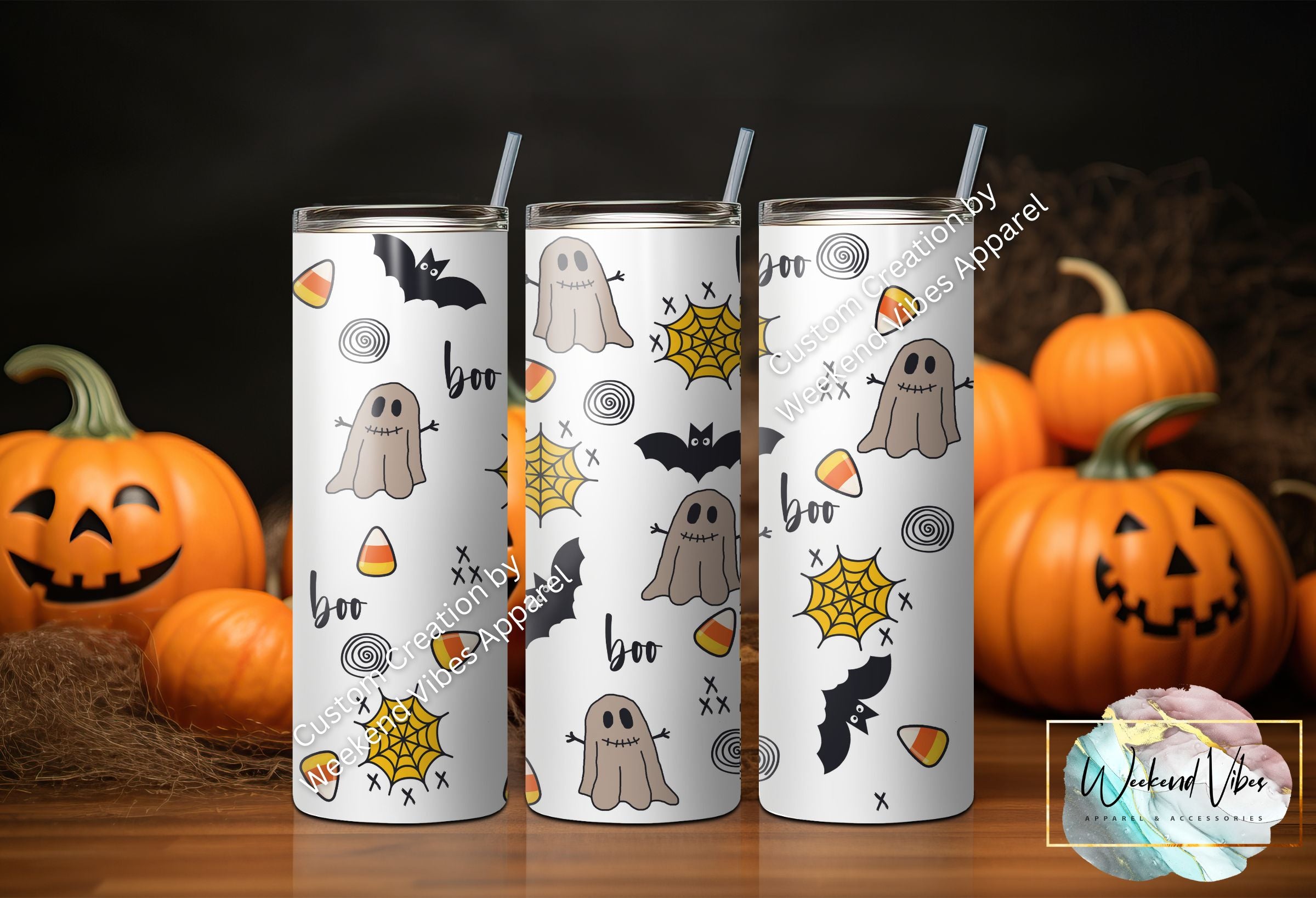 A set of three skinny tumblers with Halloween-themed designs, including ghosts and candy corn, displayed with pumpkins in the background.