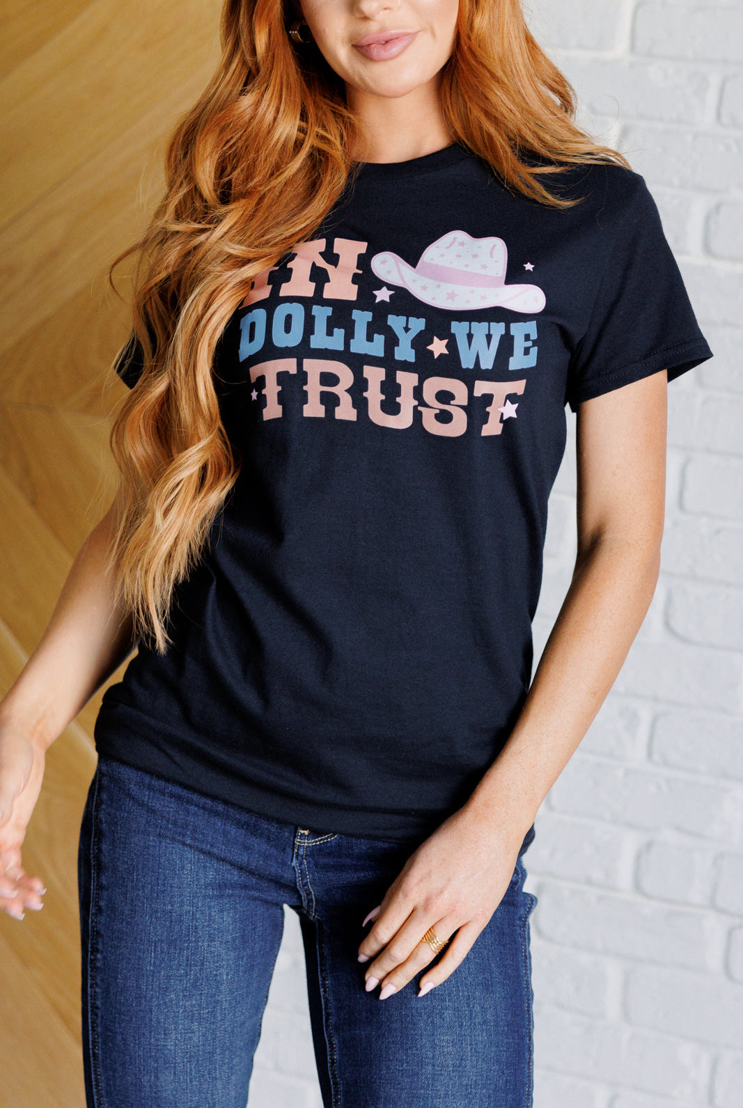 In Dolly We Trust tee with cowgirl hat and western font