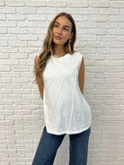 White Sleeveless Top with diagonal pleats on Casey size small