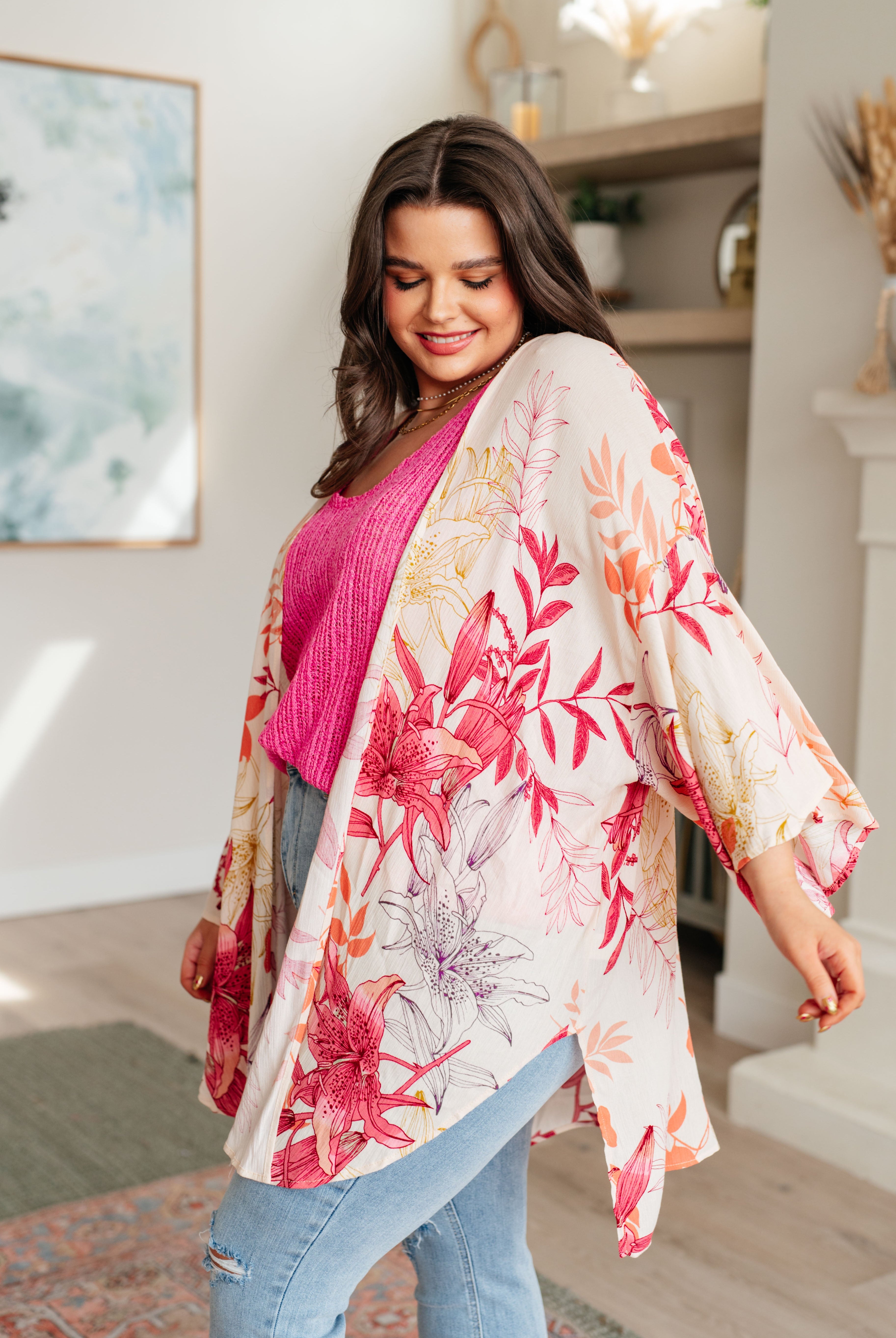 Woman wearing a floral kimono in a home setting