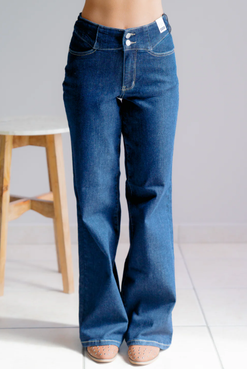 Blue jeans worn by a person on a white background