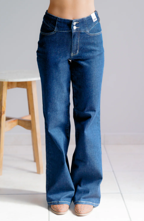 Blue jeans worn by a person on a white background