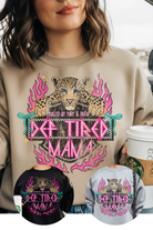 Beige sweatshirt with a leopard graphic and 'Def Tired Mama' text, displayed with black and gray sweatshirt options.