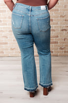 Judy Blue Mid Rise Distressed Released Hem Bootcut Jeans. Model Jordan size 14W