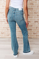 Judy Blue back view of pants Mid Rise Distressed Released Hem Bootcut Jeans - Isla