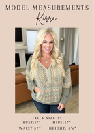 Kirra wearing a patterned sweater with model measurements displayed.