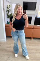 Caroline Mid Rise Control Top Distressed Flare Jeans on Kira