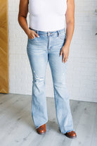Caroline Mid Rise Control Top Distressed Flare Jeans close up