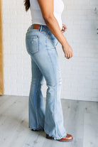 Caroline Mid Rise Control Top Distressed Flare Jeans side view on Krychelle