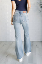 Caroline Mid Rise Control Top Distressed Flare Jeans on Casey size 0