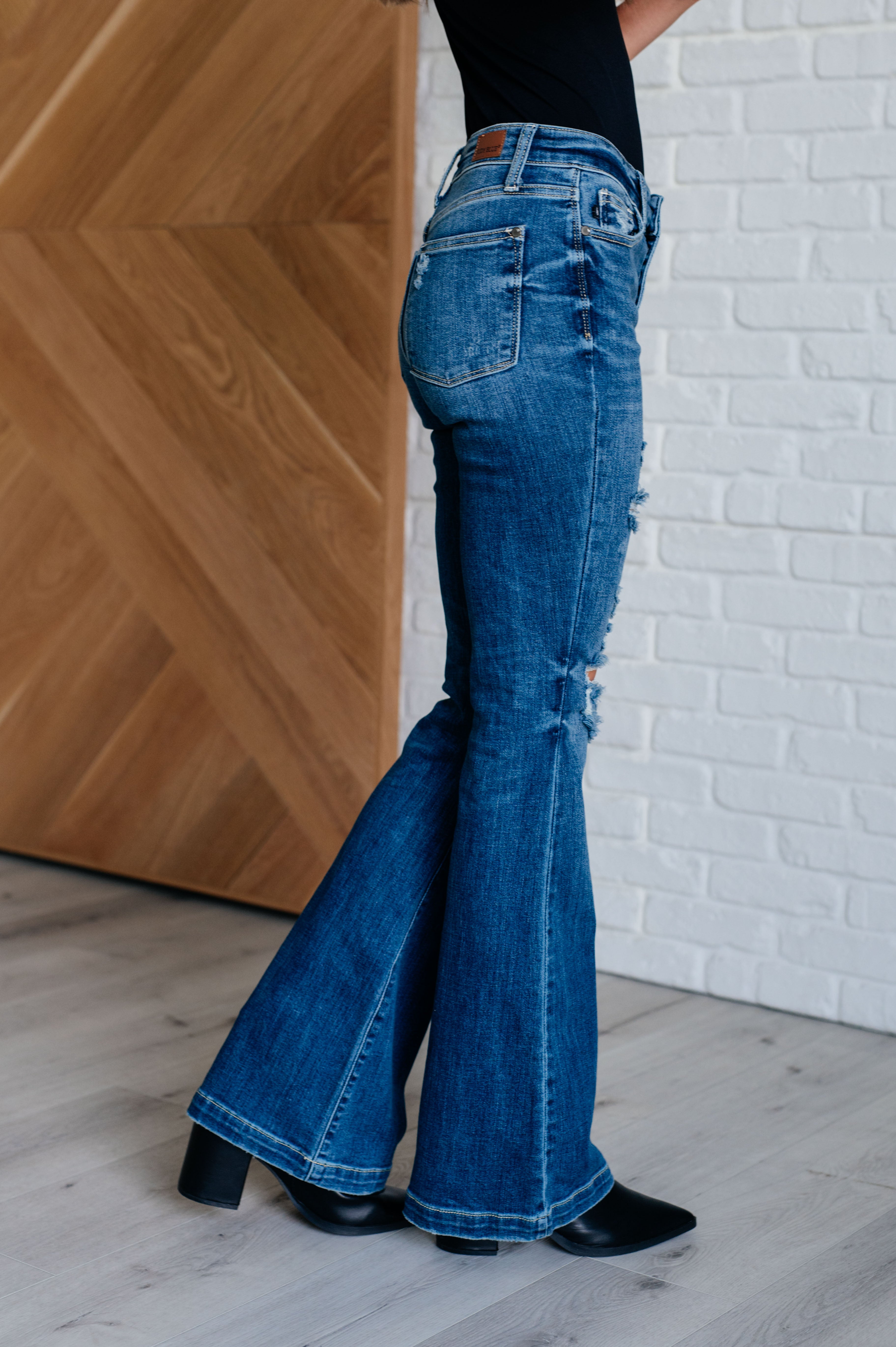 Gabriella Distressed Button Fly Flare Jeans side view on Casey