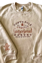 North Pole Gingerbread Bakery Handmade with love embroidered sweatshirt on sand Gildan sweatshirt