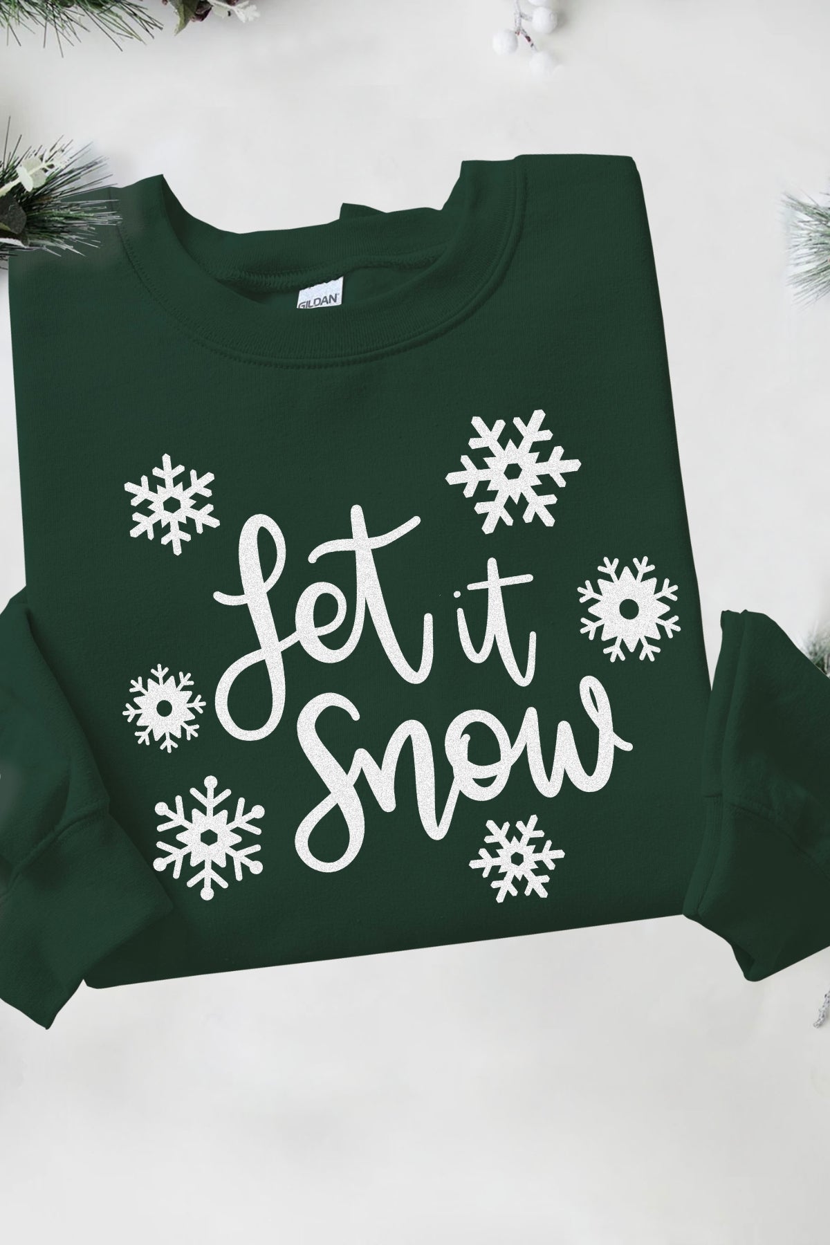 Let it Snow on dark green Gildan pullover crewneck sweatshirt