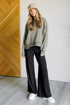 Mineral Wash Crew Neck Pullover in Army Green on Casey size Small with black lounge pants