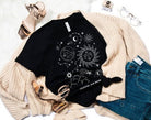 Women's Boho Graphic Tee with Celestial Sun and Moon (paired with outerwear)