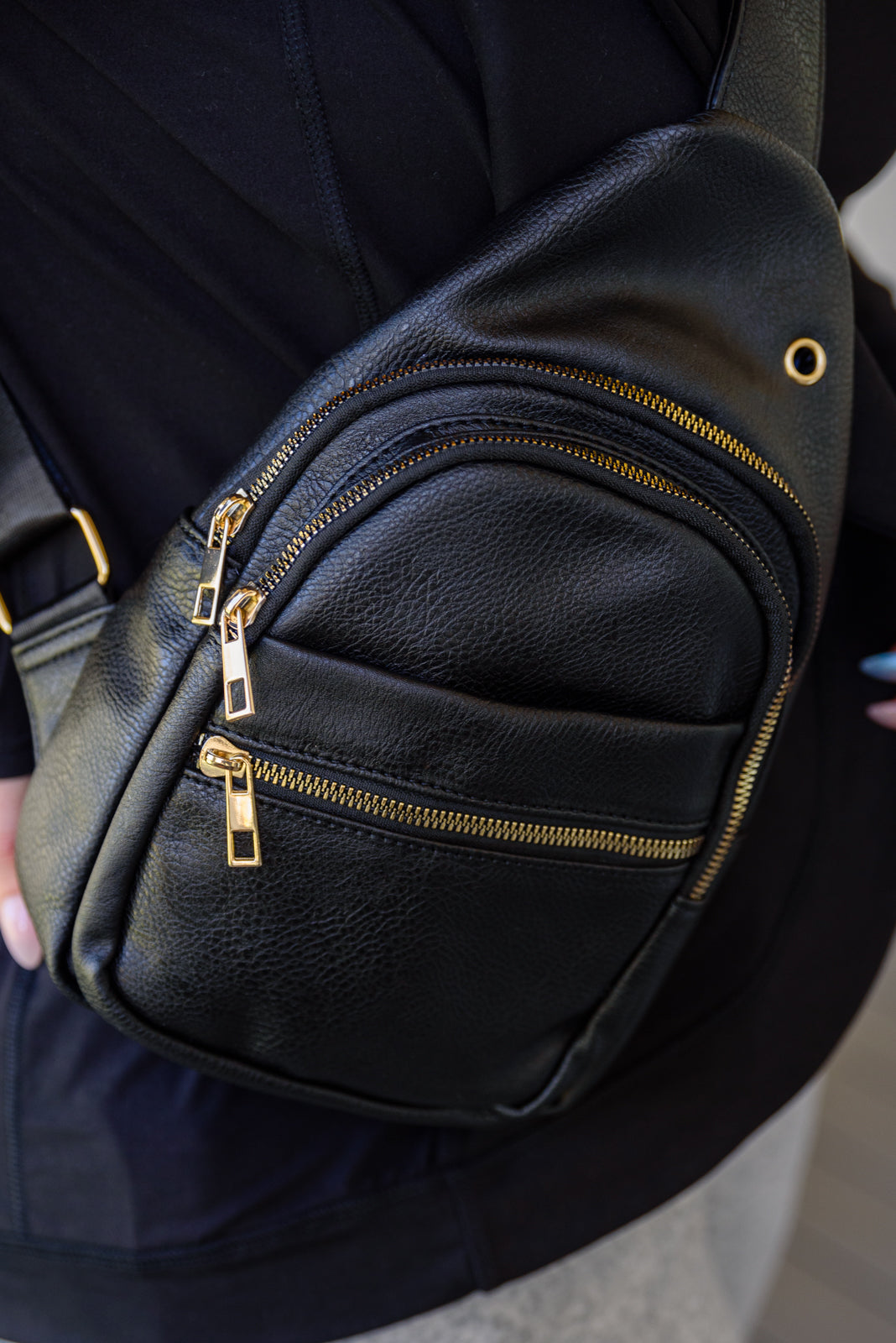 Black and gold sling bag 2025