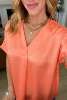 Andree by Unit Pleat Front Blouse in Orange Peach detail photo